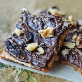 Chocolate walnut dessert squares on table.