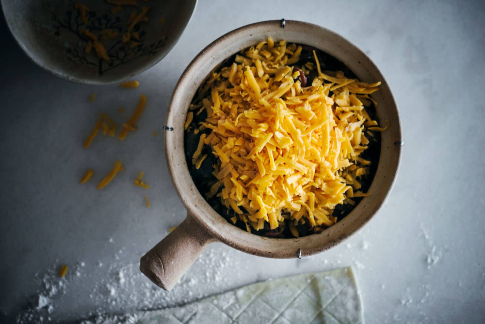 Adding cheese to steak pie