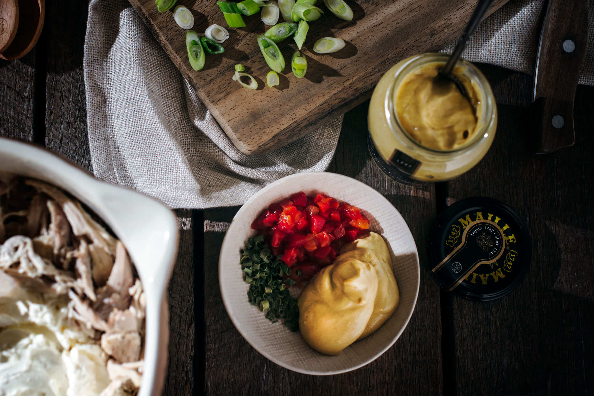 Ingredients to make savory chicken hand pies on a wooden table