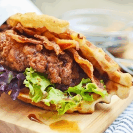 Crispy chicken sandwich with bacon and lettuce waffle