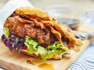 Crispy chicken sandwich with bacon and lettuce waffle