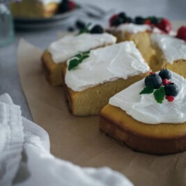 Slices of cake with icing and fruit