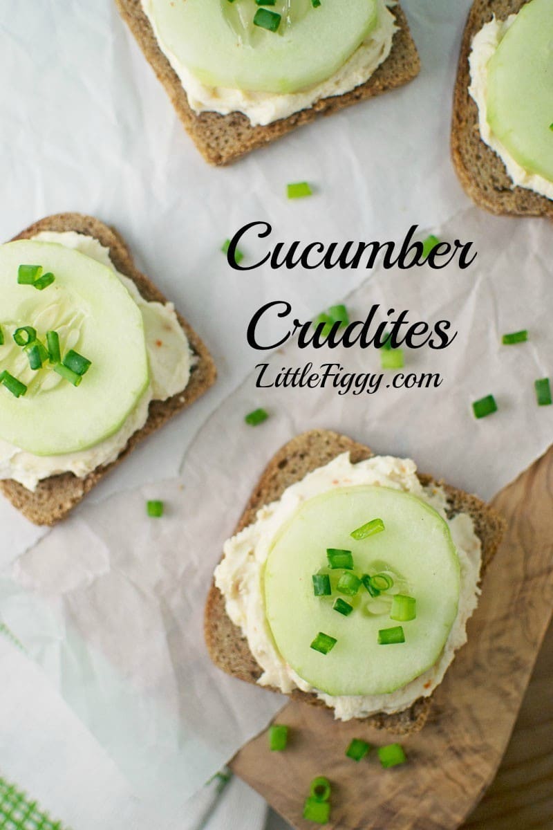 Open-faced Cucumber Crudites on rye bread with creamy spread and chopped green onions, artfully arranged on parchment paper. Cucumber Crudites LittleFiggy.com text is overlaid on the image.