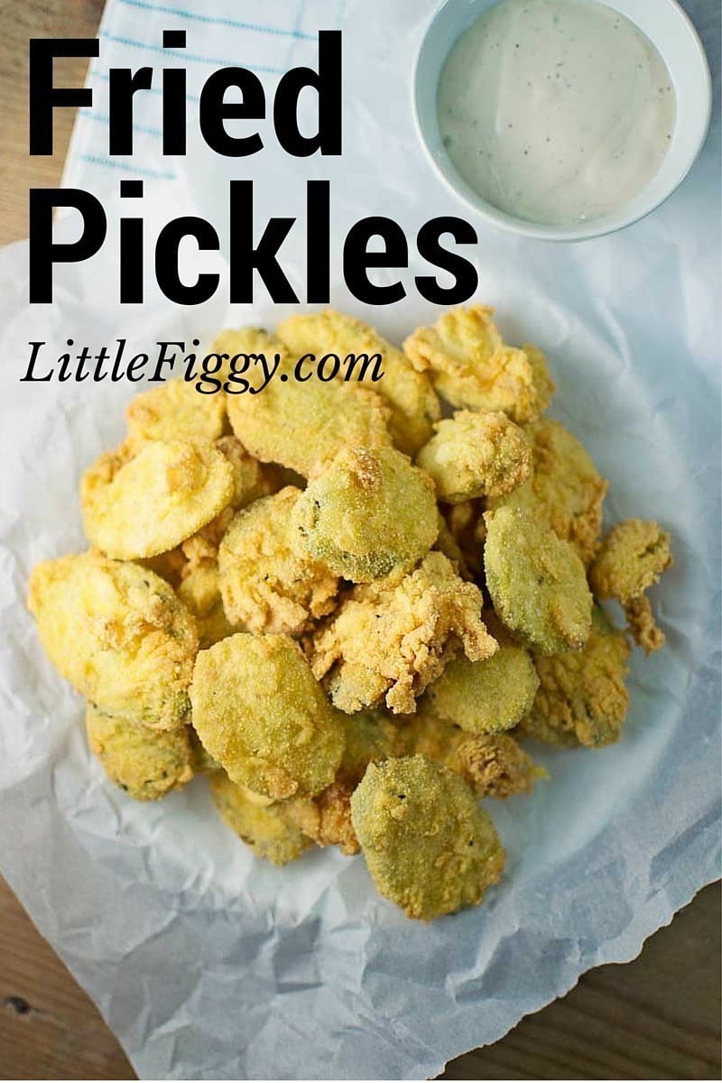 A pile of golden, crispy Fried Pickles on parchment paper with a cup of creamy dipping sauce beside them; large text reads Fried Pickles and LittleFiggy.com at the top.