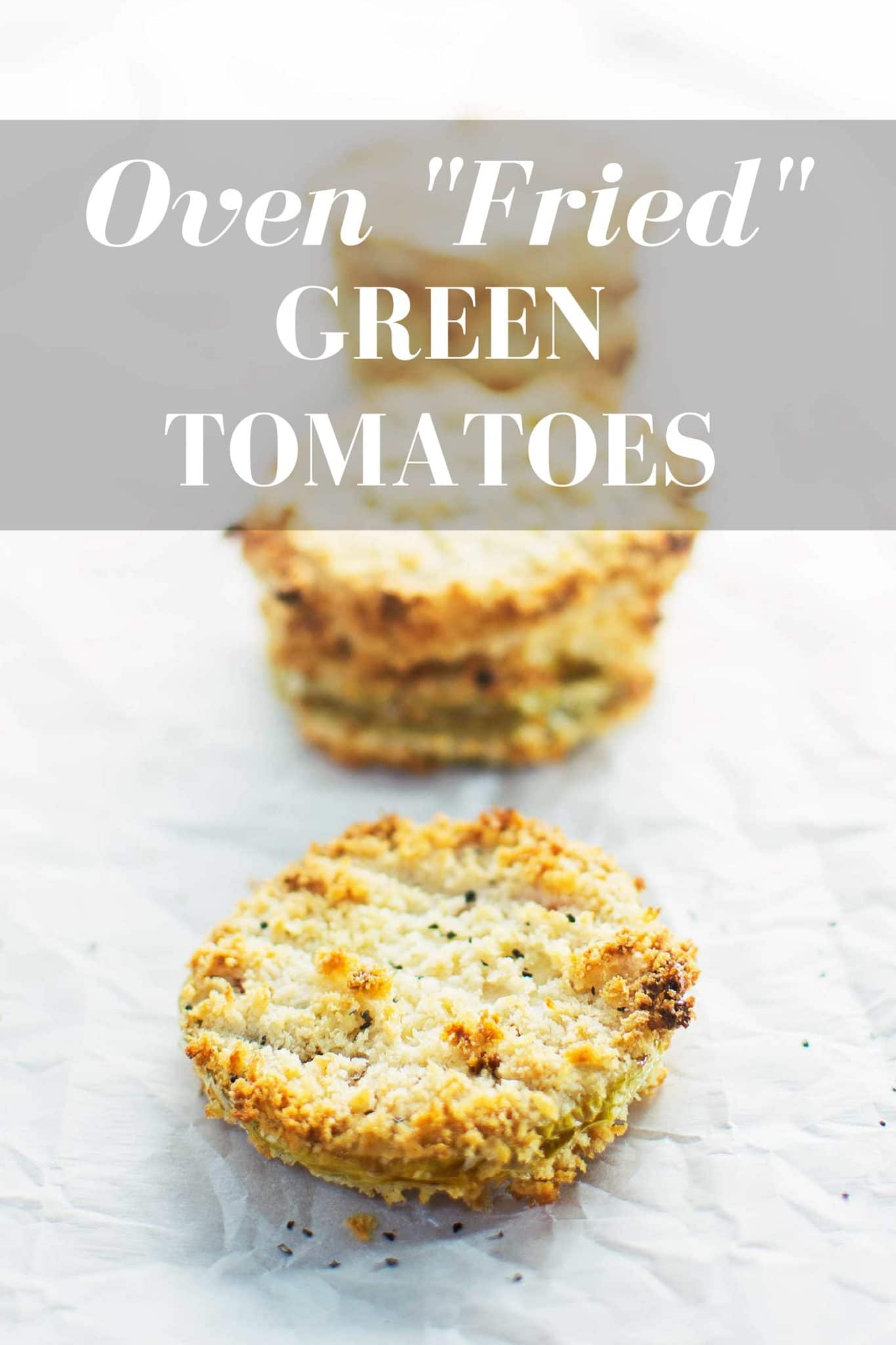 Three breaded and baked green tomato slices on parchment paper, with “Oven Fried Green Tomatoes” in bold white text at the top—an easy way to savor the crisp flavor of fresh green tomatoes.