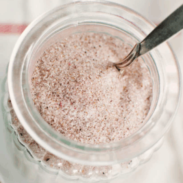 Jar of pink sea salt with spoon