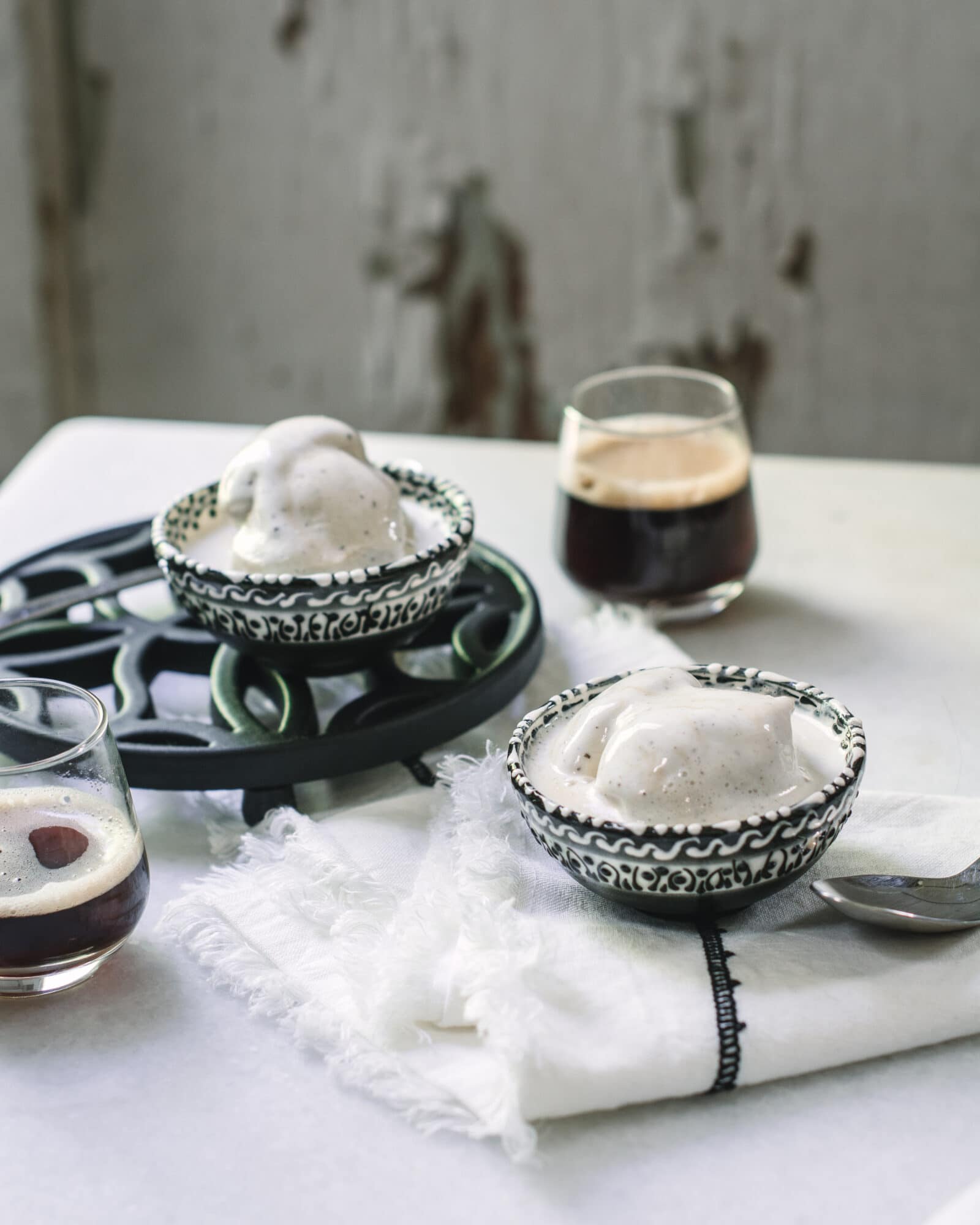 Affogato on table with white background and espresso shots