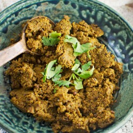 Spicy chutney with pepper, lemon, garlic garnish.