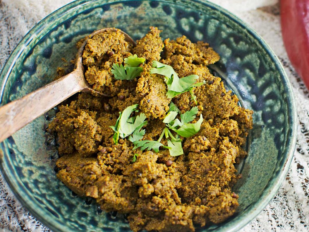 Spicy chutney with pepper, lemon, garlic garnish.