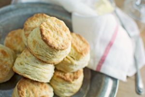 stack of flaky layered southern biscuits on a plate