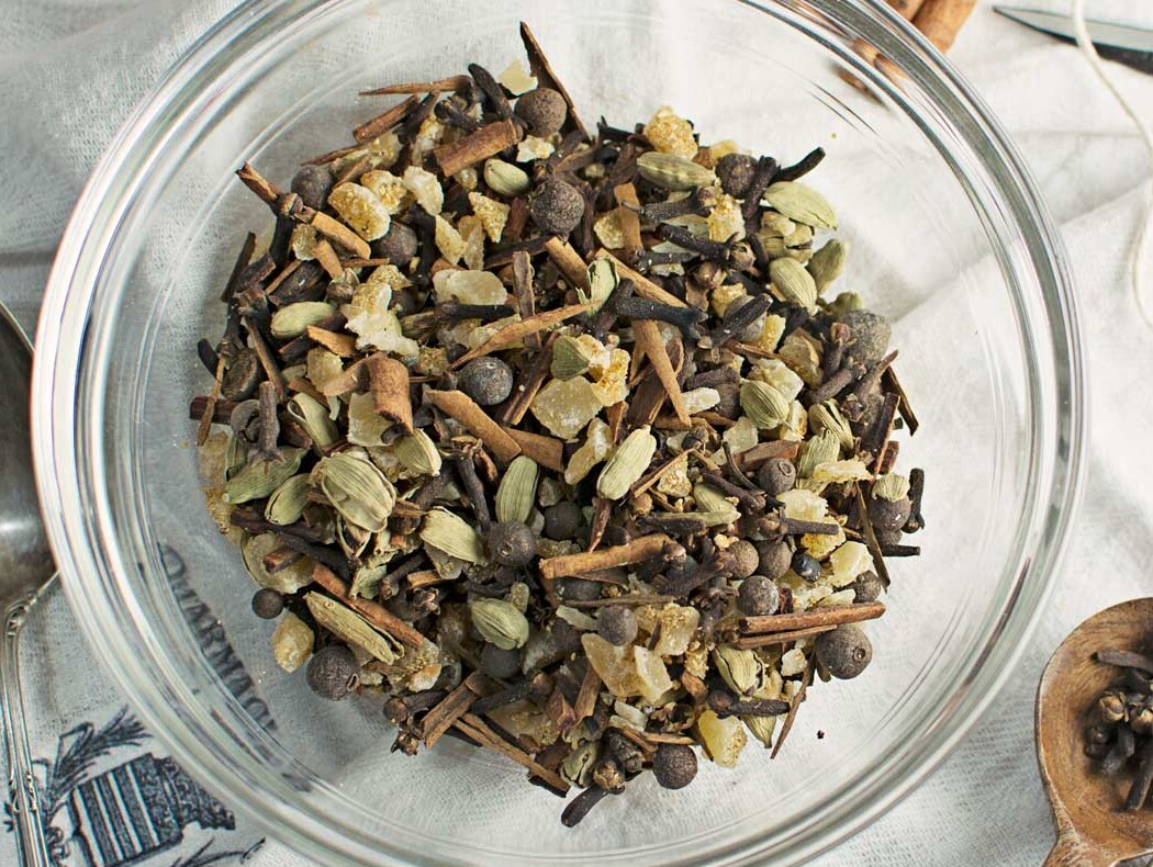 Glass bowl with mixed spices and herbs.