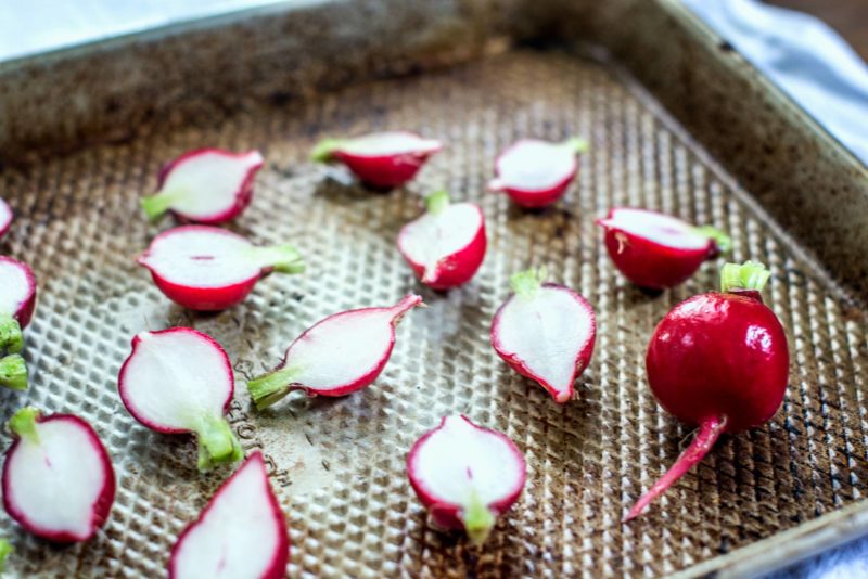 Prepping crunchy radishes before roasting. Get the recipe at Little Figgy Food.