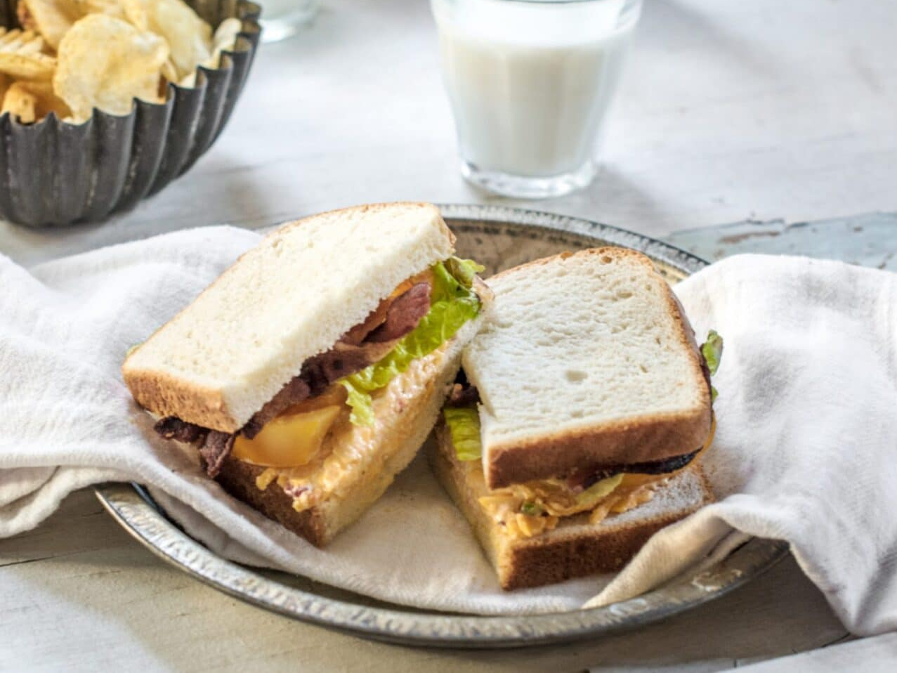 BLT sandwich with chips and milk