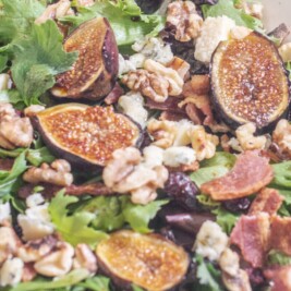 Grilled fig salad with walnuts and greens.