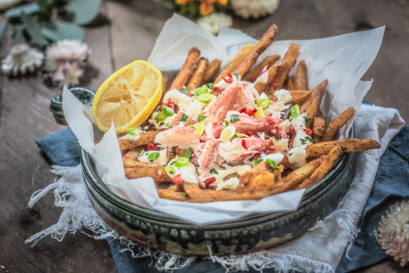 Blue bowl of loaded crab legs