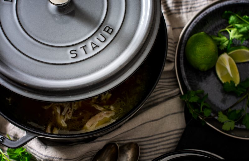 Serving Thai coconut chicken soup in a round Staub cocotte