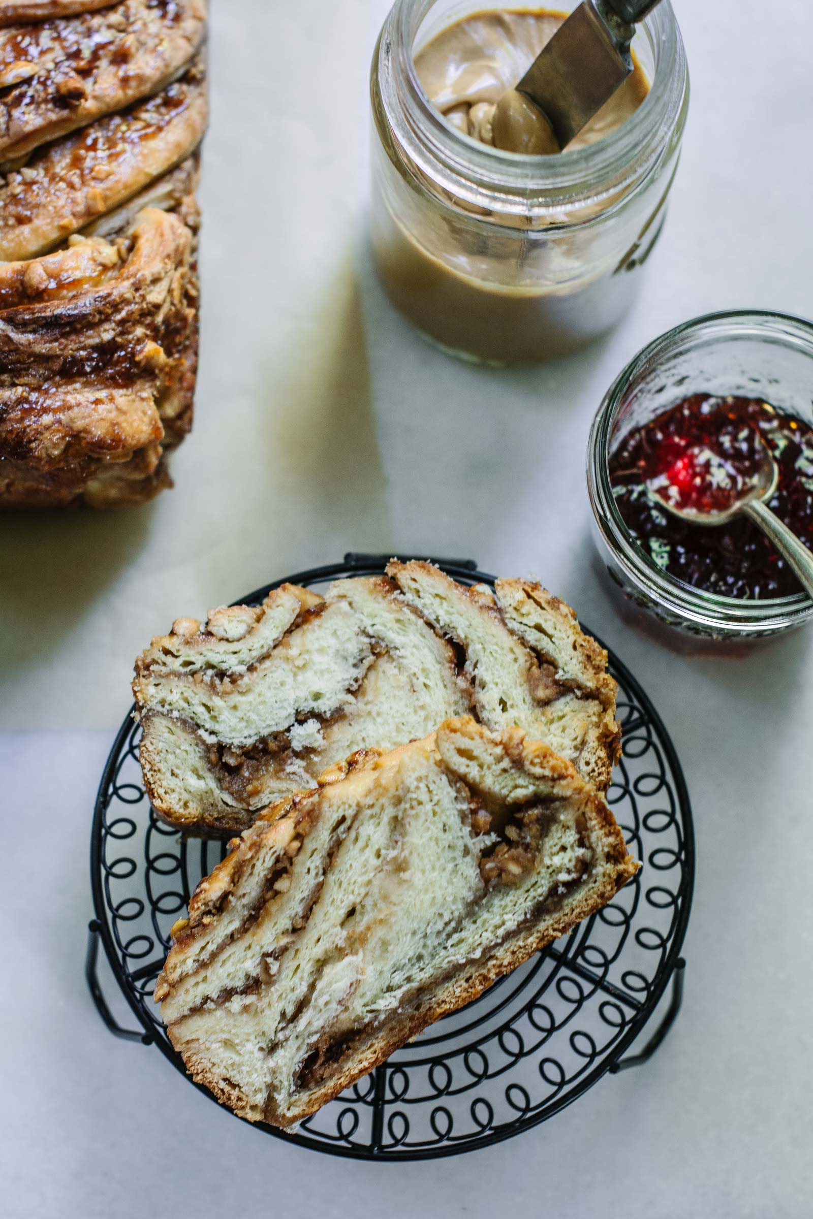Enjoying slices of Peanut Butter and Jelly Babka with extra peanut butter and jam on the side