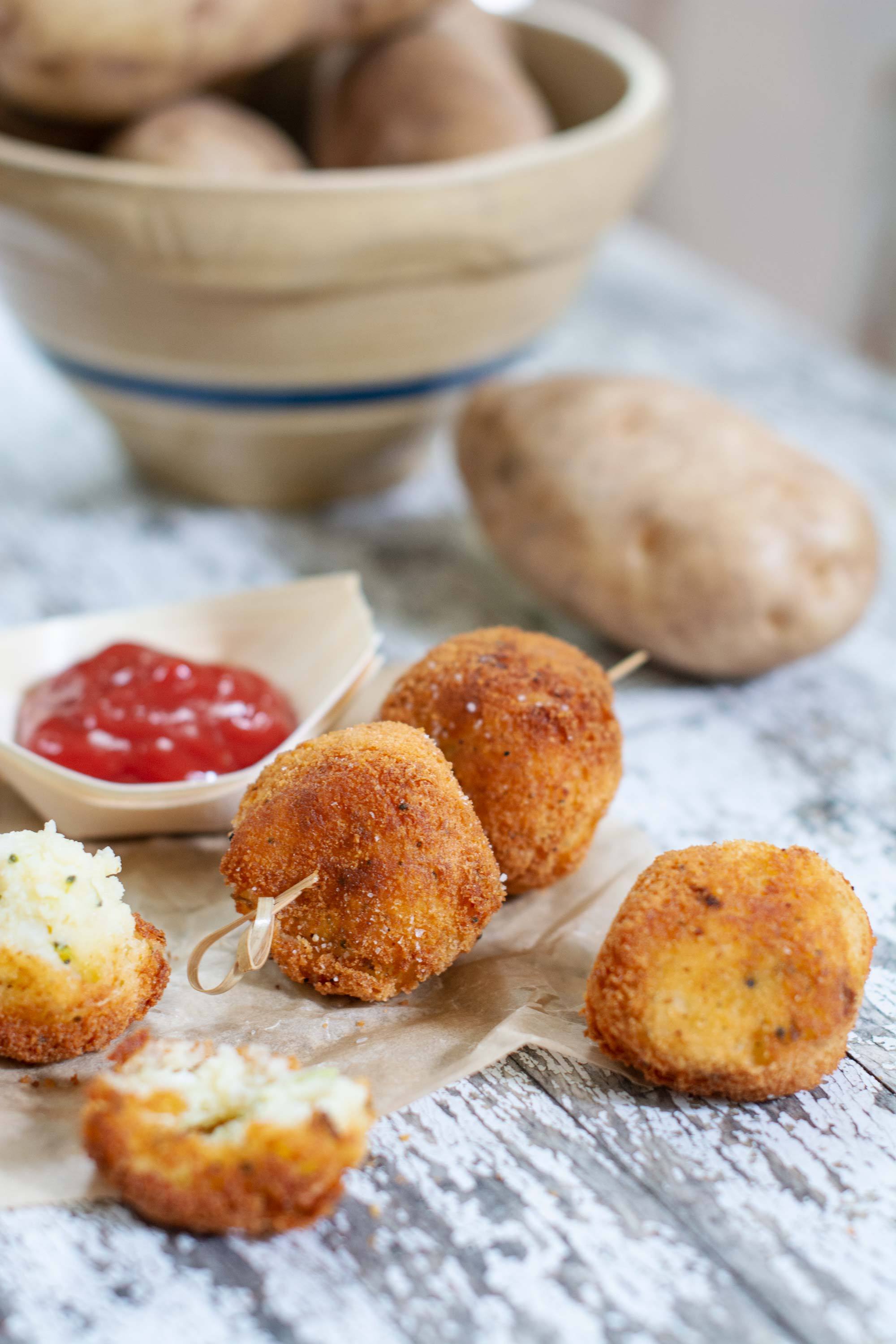 Ketchup with mashed vegetable balls and ketchup on white table