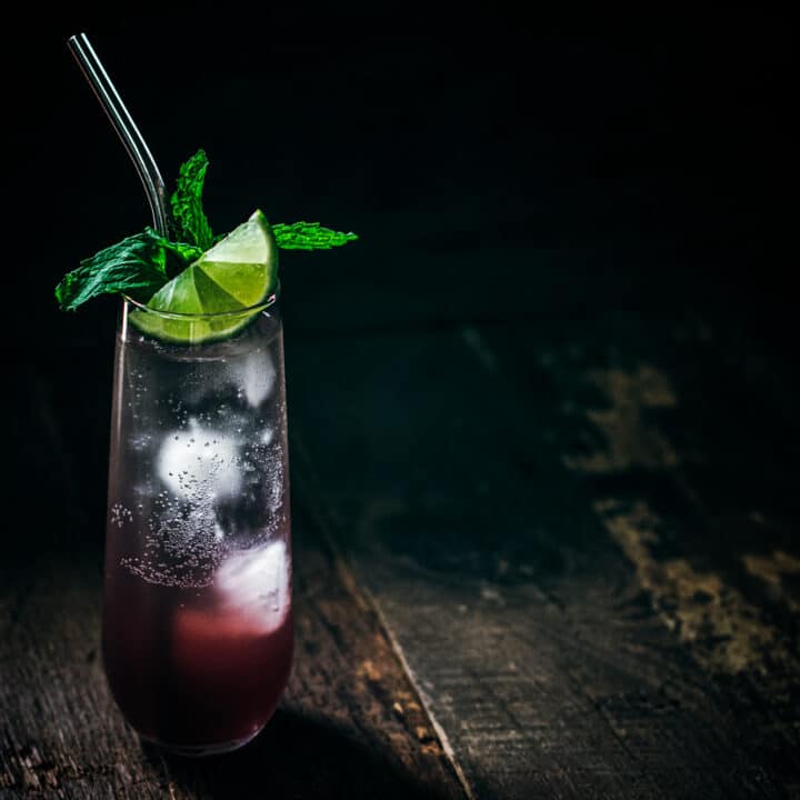 Mulled winter sangria mixed drink with lime and mint