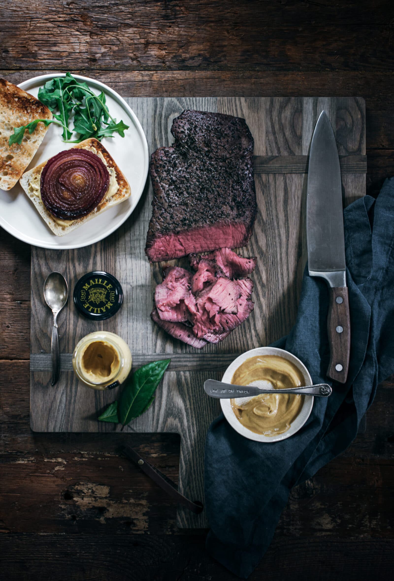 Ingredients to make a steak and onion sandwich