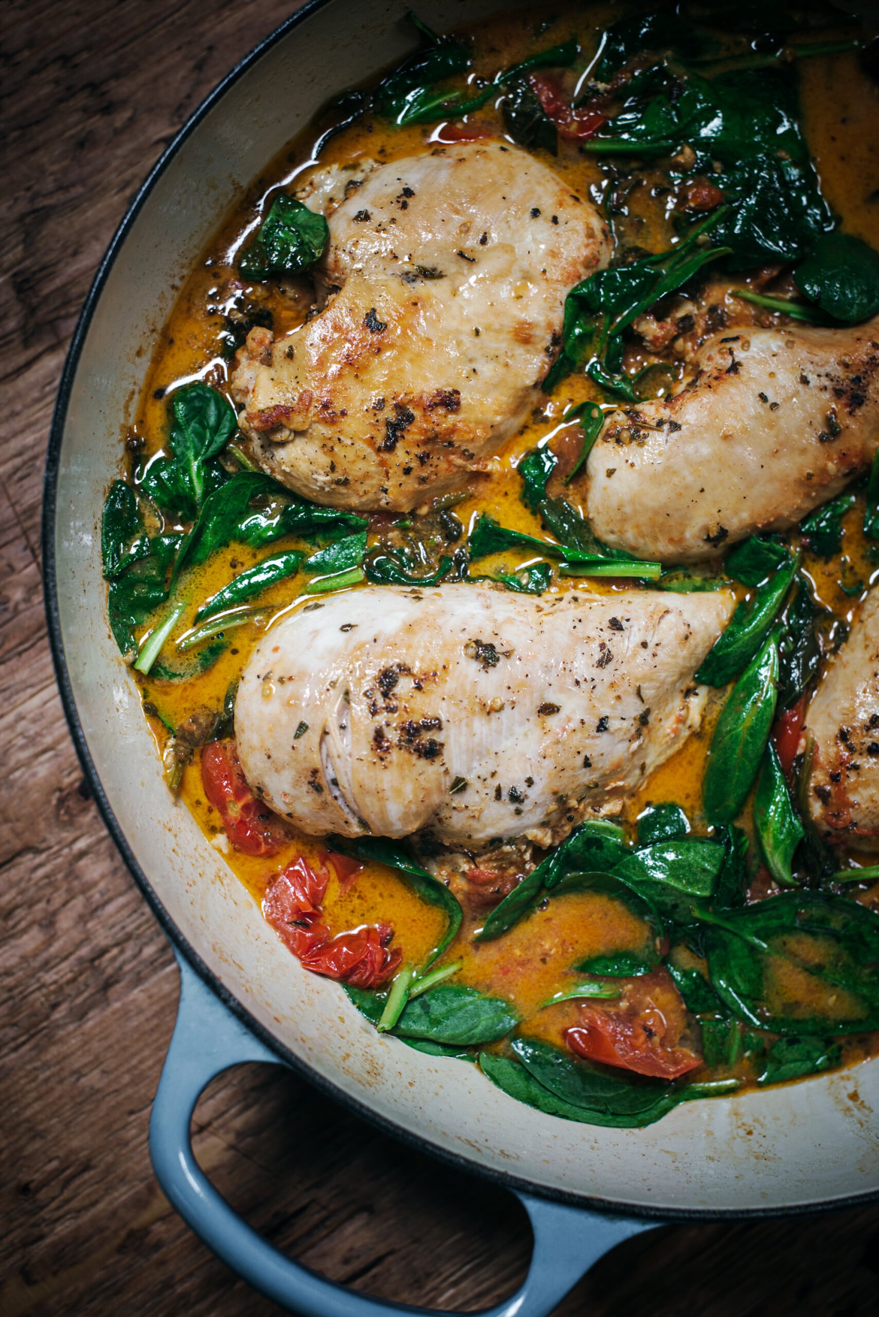 Skillet Tuscan Chicken dinner recipe idea with a creamy wine sauce and spinach