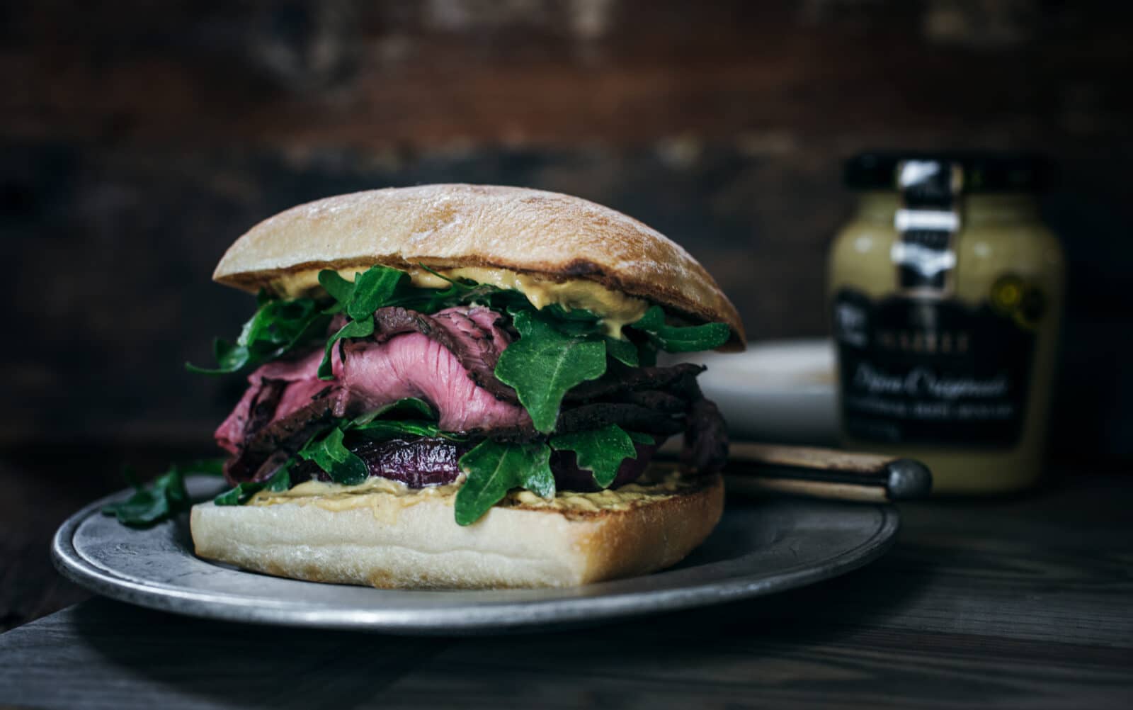 Sliced steak and caramelized onion ciabatta sandwich