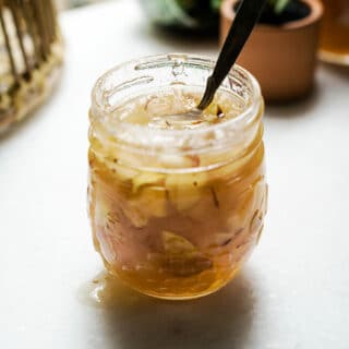 Fruit Preserves with almonds and peaches in jar - home canning