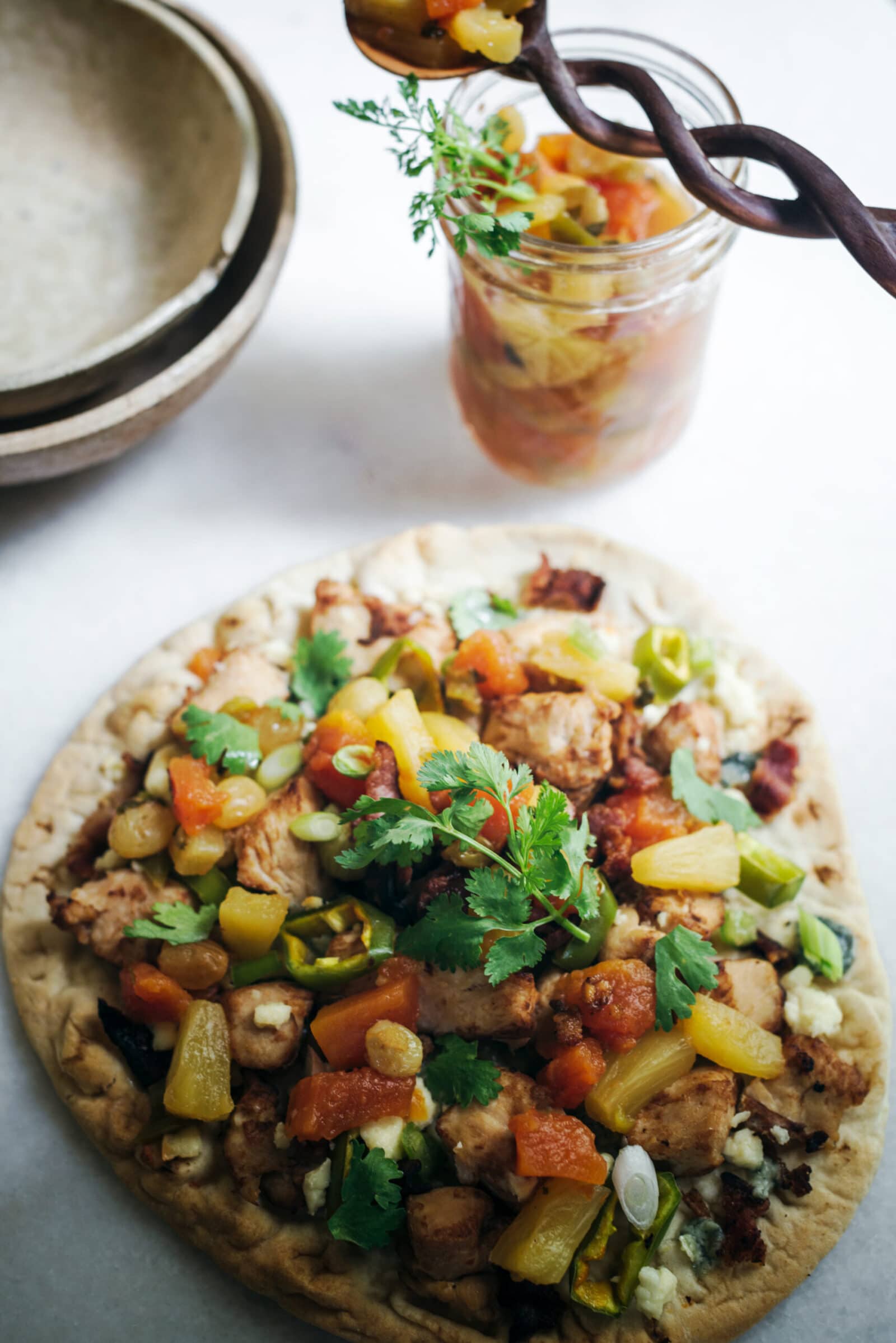 Salsa on a naan chicken pizza
