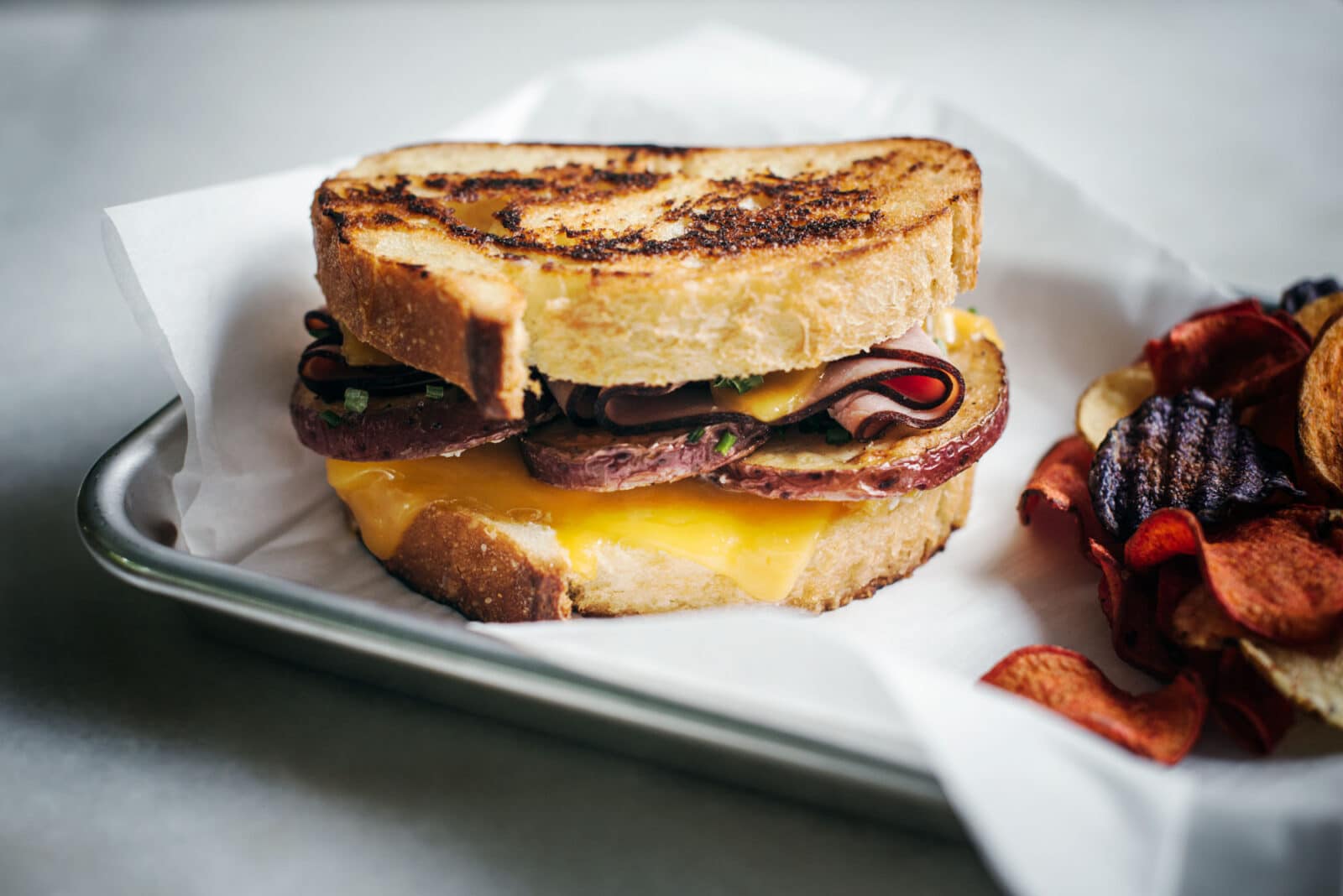 Whole ham and cheese with potatoes sandwich