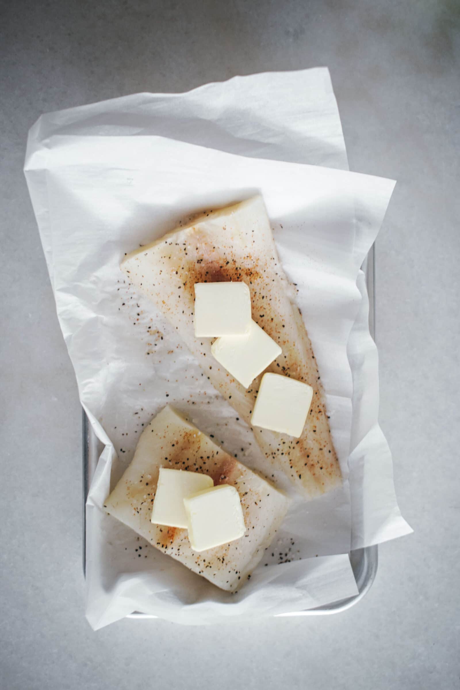 Preparing cod to bake