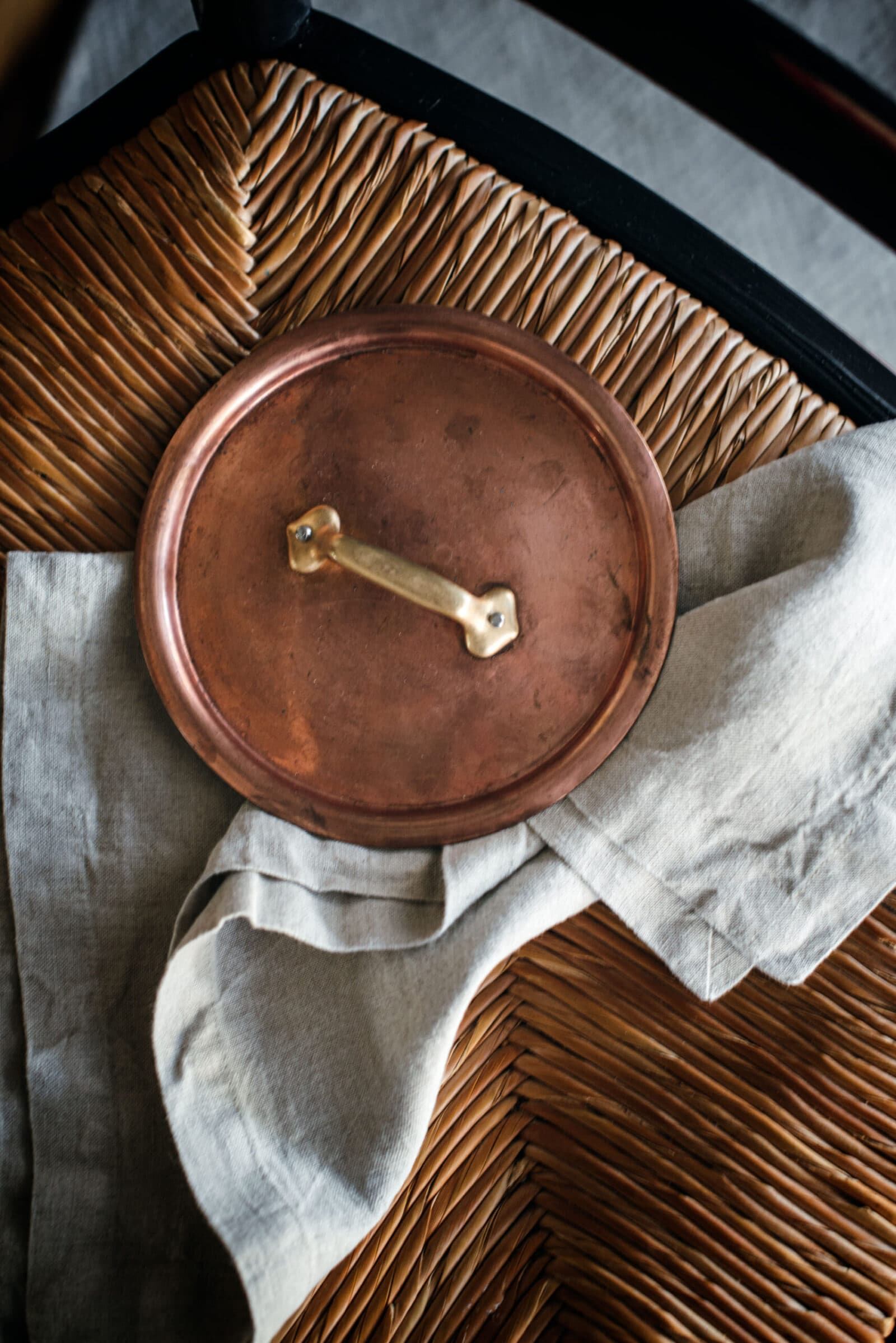 Resting pot lid on chair