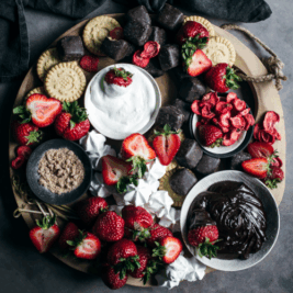 Dessert platter with strawberries and chocolate sauce.