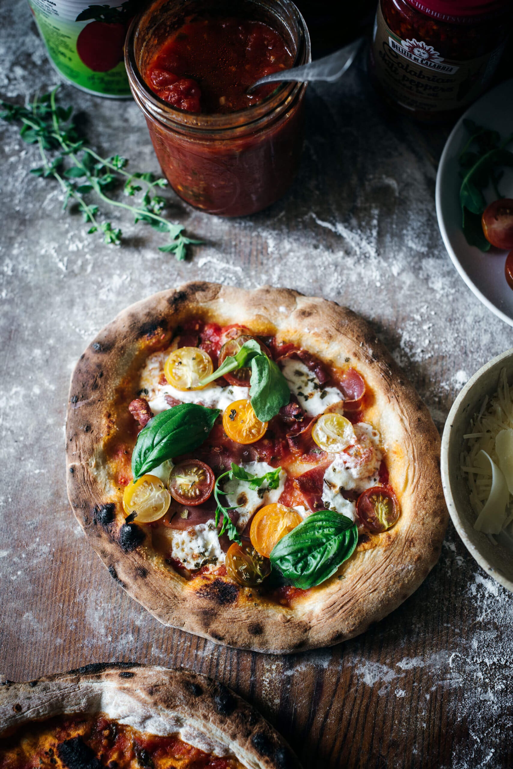 Calabrian pepper, honey, and prosciutto pizza ready to slice and serve