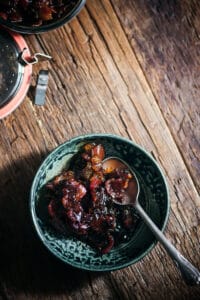 jar of bacon onion jam with a spoon