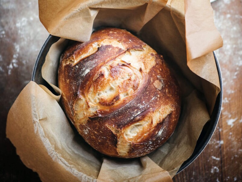 Freshly baked sourdough bread in parchment paper