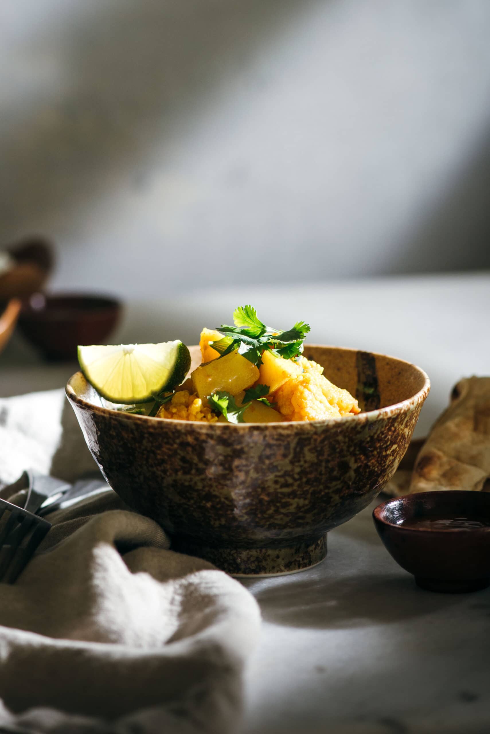 Bowl of rice and curry on white tabletop