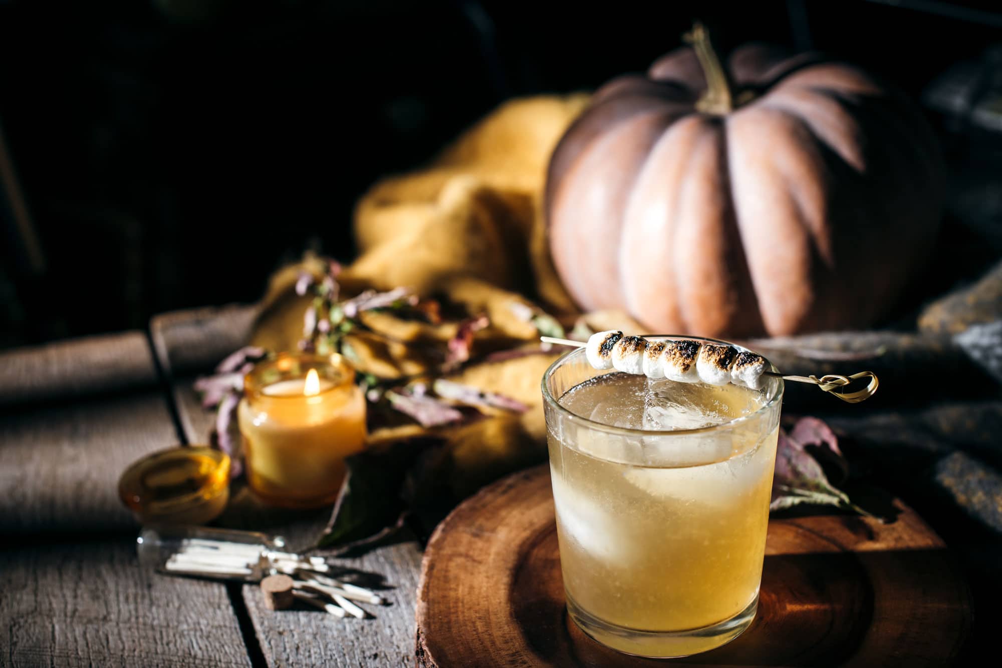 Vodka Cocktail drink on a wooden table with fall decorations
