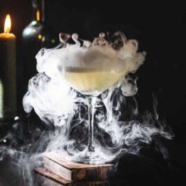 Smoke swirling around a mysterious cocktail glass.